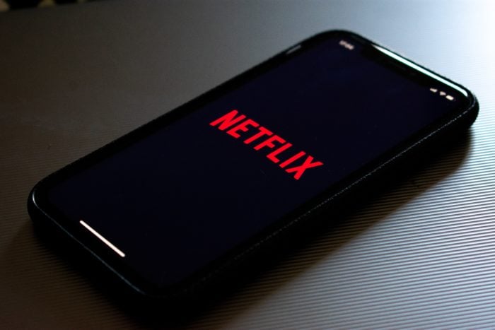 A photo of an iPhone with the Netflix app open.